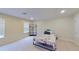 Bedroom with large window, comfortable carpet flooring and a sleek storage unit at 108 Whispering Pines Way, Davenport, FL 33837