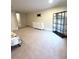Well-lit bedroom with carpet floors, shelving, and a dresser for ample storage at 108 Whispering Pines Way, Davenport, FL 33837