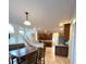 Spacious open-concept kitchen features a center island, stainless appliances, and tile floors, ideal for modern living at 108 Whispering Pines Way, Davenport, FL 33837