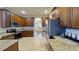 Spacious kitchen with stainless steel appliances and granite countertops at 108 Whispering Pines Way, Davenport, FL 33837