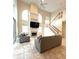 Bright living space with a staircase and fireplace at 108 Whispering Pines Way, Davenport, FL 33837