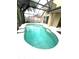 Large screened-in pool offers a refreshing escape, complemented by ample deck space for relaxation and entertainment at 108 Whispering Pines Way, Davenport, FL 33837