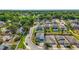Aerial view of a charming neighborhood showcasing beautiful homes, manicured lawns, and a tranquil community setting at 1155 Dora Parc Ln, Mount Dora, FL 32757