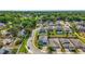 Aerial view of a charming neighborhood showcasing beautiful homes, manicured lawns, and a tranquil community setting at 1155 Dora Parc Ln, Mount Dora, FL 32757