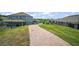 View of exterior featuring walkway and rear of home with a fenced in backyard at 1155 Dora Parc Ln, Mount Dora, FL 32757
