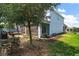 View of home's exterior featuring screened in lanai, fenced yard, and in-ground trampoline at 1155 Dora Parc Ln, Mount Dora, FL 32757