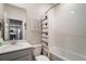 Bright bathroom featuring a shower/tub combo, white subway tile, and a vanity with modern fixtures at 1155 Dora Parc Ln, Mount Dora, FL 32757