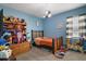 room with wooden furniture, window with blinds, and decorative ceiling fan at 1155 Dora Parc Ln, Mount Dora, FL 32757