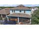 Aerial view of home's exterior featuring a screened in lanai, fenced yard, and mature trees at 1155 Dora Parc Ln, Mount Dora, FL 32757