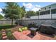 Paver patio featuring outdoor kitchen and bar-b-que, with comfortable seating and hardscape walls at 1155 Dora Parc Ln, Mount Dora, FL 32757