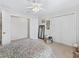 Bedroom features carpet floors, closet and a well-lit window at 12118 Se 175Th Loop, Summerfield, FL 34491