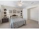 Inviting bedroom features carpet floors, ceiling fan and traditional styling at 12118 Se 175Th Loop, Summerfield, FL 34491