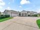 Charming home with a well-manicured lawn and an attached three car garage at 12118 Se 175Th Loop, Summerfield, FL 34491