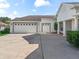 Spacious three-car garage with painted doors and updated hardware at 12118 Se 175Th Loop, Summerfield, FL 34491