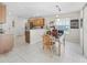Bright eat-in kitchen features tile floors, stainless steel appliances, and wooden cabinets at 12118 Se 175Th Loop, Summerfield, FL 34491