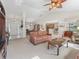 Bright living room with a ceiling fan and an open floor plan at 12118 Se 175Th Loop, Summerfield, FL 34491
