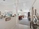 Open-concept living space with neutral colors, column, and a welcoming atmosphere at 12118 Se 175Th Loop, Summerfield, FL 34491