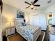 Comfortable bedroom with a nautical theme, ceiling fan, and ample closet space at 1342 Royal Saint George Blvd, Davenport, FL 33896