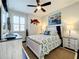 Comfortable bedroom with a nautical theme, ceiling fan, and ample closet space at 1342 Royal Saint George Blvd, Davenport, FL 33896