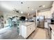 Open-concept kitchen and living space with an island, modern appliances, and dining area at 1342 Royal Saint George Blvd, Davenport, FL 33896