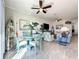 Open-concept living space with dining area, ceiling fan and stylish furnishings at 1342 Royal Saint George Blvd, Davenport, FL 33896
