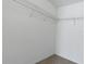 Walk-in closet with wire shelving for easy organization and storage at 13875 Se 97Th Ave, Summerfield, FL 34491