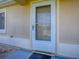 Well-maintained front door with glass screen and storm door at 13875 Se 97Th Ave, Summerfield, FL 34491