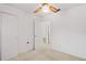 A simple bedroom with neutral carpet and a ceiling fan for added comfort at 1416 Abigail Dr, Apopka, FL 32703