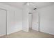 A simple bedroom featuring neutral carpet and a ceiling fan at 1416 Abigail Dr, Apopka, FL 32703