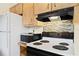 Efficient kitchen featuring updated appliances, mosaic backsplash and wood cabinets at 1416 Abigail Dr, Apopka, FL 32703