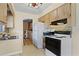 Cozy kitchen with appliances, tile backsplash, and ample storage space at 1416 Abigail Dr, Apopka, FL 32703