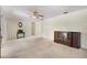 Spacious living room with neutral carpet, ceiling fan, and ample room for furniture arrangement at 1416 Abigail Dr, Apopka, FL 32703
