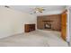 Inviting living room with brick fireplace and neutral carpet at 1416 Abigail Dr, Apopka, FL 32703