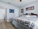 Bedroom with hardwood floors, ceiling fan, and artwork on the walls at 1722 Moreno Pl, The Villages, FL 32159