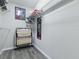 Walk-in closet with shelves and a place to hang clothes with art at 1722 Moreno Pl, The Villages, FL 32159