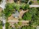 Aerial view of home nestled among lush trees, showcasing its location at 1725 14Th St, Orange City, FL 32763