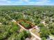 Aerial view of the property's location surrounded by lush greenery and a quiet neighborhood, outlined in red at 1725 14Th St, Orange City, FL 32763