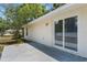 Outdoor patio featuring a sliding glass door, offering access to the backyard at 1725 14Th St, Orange City, FL 32763