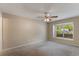 Bedroom featuring neutral walls, carpet, a ceiling fan, and a window at 1725 14Th St, Orange City, FL 32763