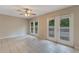 Bonus room with dual french doors, tiled flooring, and a ceiling fan at 1725 14Th St, Orange City, FL 32763