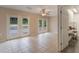 Bonus room with dual french doors, tiled flooring, and a ceiling fan at 1725 14Th St, Orange City, FL 32763