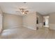 Bonus room featuring tile flooring, ceiling fan, and an adjacent storage room at 1725 14Th St, Orange City, FL 32763