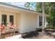 Home exterior with trimmed bushes, manicured mulch beds, double doors and a no soliciting sign at 1725 14Th St, Orange City, FL 32763