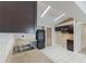 Galley style kitchen featuring stainless steel sink, microwave and appliances with white tile flooring at 1725 14Th St, Orange City, FL 32763