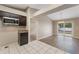 Bright kitchen features an open design and stainless steel microwave, and adjacent dining area at 1725 14Th St, Orange City, FL 32763