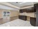 Open kitchen layout with stainless steel appliances, dark cabinets, and an eat-in area at 1725 14Th St, Orange City, FL 32763