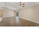 Spacious living area with wood-look flooring and sliding glass doors to the backyard at 1725 14Th St, Orange City, FL 32763