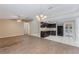 Bright and open living space flowing into the kitchen featuring a ceiling fan and natural light at 1725 14Th St, Orange City, FL 32763