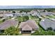 Residential home featuring a well-maintained lawn, screened lanai, and lush landscaping in a vibrant community at 1813 Caryle Ln, The Villages, FL 32162