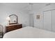 Cozy bedroom with neutral walls, traditional furniture, and ample closet space at 1813 Caryle Ln, The Villages, FL 32162